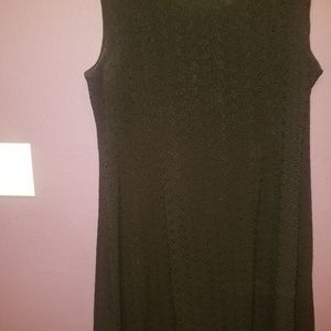 Mid-length black shapely dress.  Has a great feel